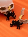 Detail of black acrylic cat pendant and yellow lightning stud earrings on orange background - Black Cat and Yellow Lightning Earrings