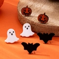 Detailed view of Halloween earring set with pumpkin, ghost, and bat studs on a wood stand - Pumpkin, Ghost, and Bat Stud Earrings Set