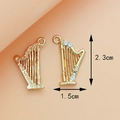 Golden harp charms with rhinestones and 2.3cm measurement for DIY jewelry making - Harp KC Gold