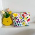 Floral canvas makeup bag in white with colorful flower prints and fun party label - Colorful Garden