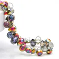 Macro detail of faceted K9 crystal beads with iridescent AB coating and teardrop cut - Half Purple Rose Red / 6mm (approximately 87 Beads Per Strip)