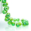 Sparkling green faceted teardrop crystal glass beads with rainbow shimmer for DIY jewelry - Grass Green AB / 6mm (approximately 87 Beads Per Strip)