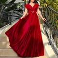 Elegant red velvet maxi dress with V-neckline, ruffles, and waist belt on a woman - S / Burgundy