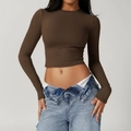 Detail of slim fit dark brown long sleeve yoga top paired with retro light blue jeans - Coffee