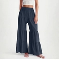 Detail of tiered wide-leg trousers showing the layered fabric and elastic high waist - S / Navy Blue