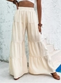 Detail showing the layered tiered design and crinkle texture of beige high-waist wide-leg pants - S / Apricot