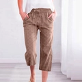 Detailed view of drawstring waist and geometric diamond pattern on khaki cropped pants - S / Peach