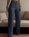 Detailed view of high waisted pleated trousers in grey blue with a sleek drapery texture - S / Gray