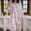 Detail of floral print cotton pajamas showing drawstring collar and elastic cuffs - White Red Floral Sketch