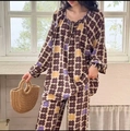 Detail of floral printed cotton pajama set with drawstring neckline and elastic cuffs - Retro Large Floral