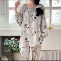 Detailed view of floral printed pajama set with tie neckline and comfortable loose fit - Grey Black Floral