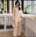 Detail of floral printed cotton pajama set featuring lace-up collar and lantern sleeves - Beige Purple Floral