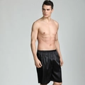 Men's black faux silk pajama shorts with elastic waist and smooth satin finish - M / Pure Black