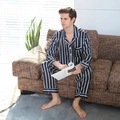 Men's navy silk striped pajama set with long sleeve shirt and trousers on sofa - Blue Striped Style
