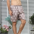 Men's silk satin lounge shorts featuring vintage red paisley print with elastic waistband - Red Square
