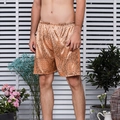 Men's silk satin lounge shorts with vintage circular pattern in bronze gold finish - Deep Gold