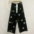 Detail view of cotton wide-leg pajama pants with panda print and white satin ribbon bow - Black Panda