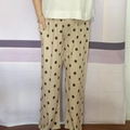 Detail of loose fit polka dot wide leg pants featuring side pockets and elastic waist - One Size / Beige Polka Dot