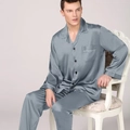 Men's grey satin pajama set featuring a long-sleeve button-down top and matching trousers - Gray