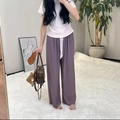 Detail of loose dark purple wide-leg pajama pants with high waist and white drawstring - Taro Purple