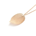 Detail of natural leaf pendant necklace with fine gold plated hollowed vein texture - Gold Necklace