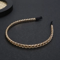 Elegant gold metal chain headband for women with black fabric comfort ends on dark background - Gold