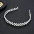 Elegant silver metal headband with three rows of white pearls on dark gray texture - Silver