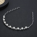 Elegant wavy silver metal headband featuring white pearls and sparkling rhinestones - Silver