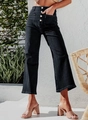Detail of high waisted black wide-leg denim jeans with gold button fly and cargo pockets - S / Black