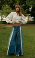 Detail of high-waisted wide-leg jeans with side buttons and beige contrast stitching - S / Blue