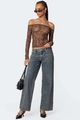 Detail of high-waisted wide leg jeans paired with leopard print mesh long sleeve top - S / Vintage Blue