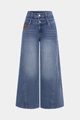 Détail d'un jean bleu taille haute avec double taille et deux boutons argentés - S / Bleu