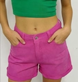 Detail of rose pink denim shorts with rolled hems and distressed vintage texture - Rose Red