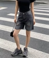 Detailed view of frayed hem and ripped accents on high-waisted washed black denim shorts - S / Gray