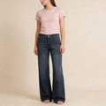 Detail of wide-leg dark blue denim jeans with washed texture and cat whisker patterns - S / Vintage Blue