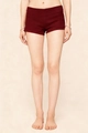 Detail of high-waist wine red slim stretch shorts showing stitching and fabric texture - S / Burgundy