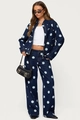 Detail of dark blue denim set with light blue polka dots featuring jacket and trousers - S / Blue