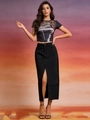 Front full shot of female model wearing retro print crop top and black split denim skirt - S / Black