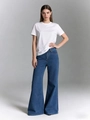 Full-body shot of a woman in white T-shirt and vintage high-waisted wide-leg jeans - S / Blue