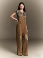 Detail view of distressed brown denim overalls featuring ripped fringe and retro aesthetic - S / Coffee