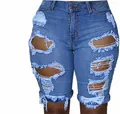 Close-up of distressed denim shorts with ripped details and frayed hem on blue fabric - 3XL / Bottoms / Medium Blue