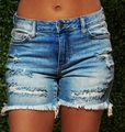 Classic blue distressed denim shorts with ripped holes and large tassel frayed hem for women - S / Dark Blue