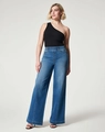 Detail van een donkerblauwe wijde jeans met hoge taille, middennaad en zwarte hakken - S / Blauw