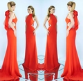 Detail of red halter neck evening gown with waist cut-outs and large back bow - S / Orange
