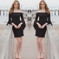 Detail of off-shoulder neckline and dramatic bell sleeves on a slim black cocktail dress - S / Black