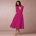 Detailed view of the deep V-neck and midi pleated skirt of the elegant magenta evening dress - Rose Red