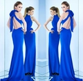 Elegant royal blue halter neck backless evening gown featuring a large bow and fishtail hem - S / Blue