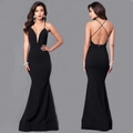 Detail of elegant black fisheye evening dress with deep V-neck and crisscross back straps - S / Black