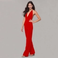 Detail of red halter neck jumpsuit featuring a deep V-neck and wide leg design - S / Red