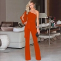 Detail of orange one-shoulder jumpsuit featuring waist belt and cut-out sleeve design - Orange
